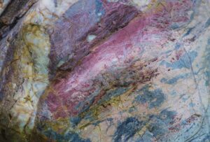 Close-up of a multicolored stone texture showcasing natural patterns and colors in Kyiv, Ukraine.